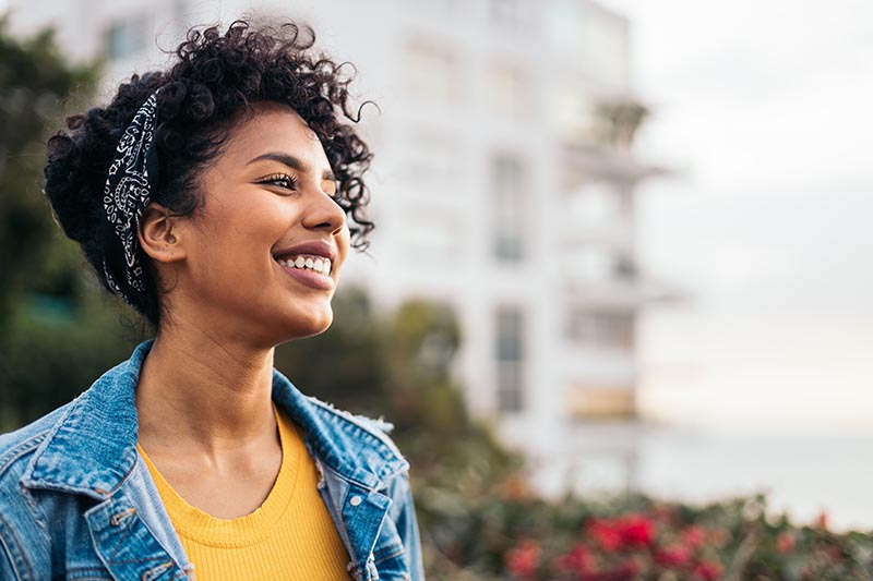 Young latin woman smiling genuinely